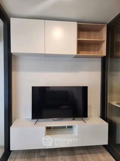 Modern living room with sleek TV unit and stylish cabinetry