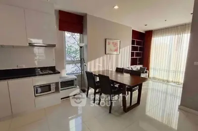 Spacious modern living room with dining area and natural light