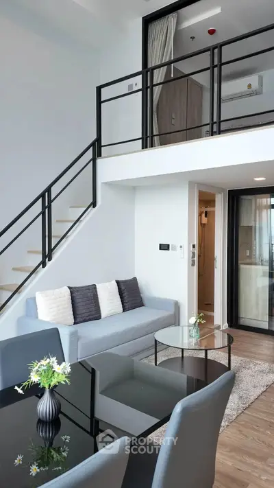 Modern duplex living room with stylish furniture and open layout