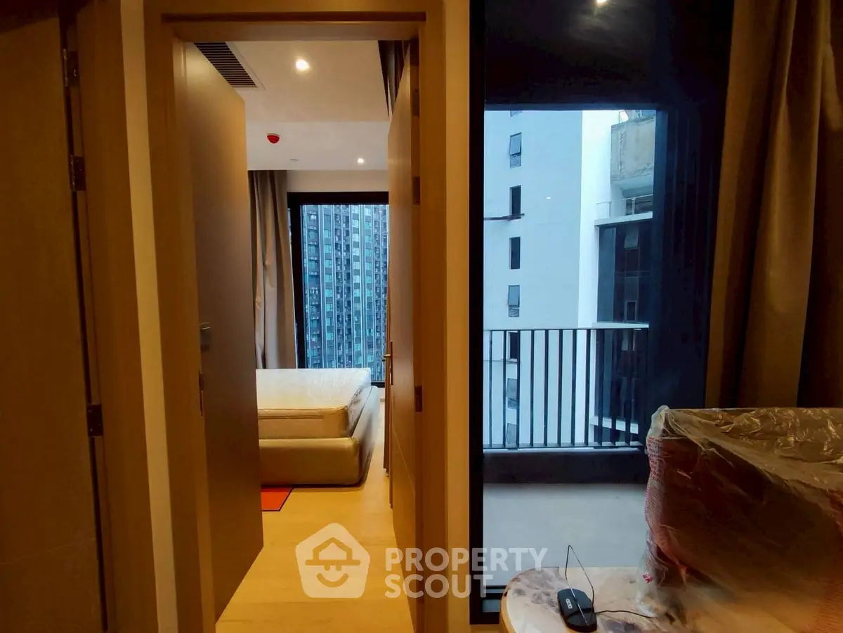 Modern apartment with bedroom and balcony view in urban setting