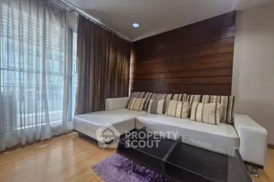 Stylish living room with modern sofa and wooden accent wall