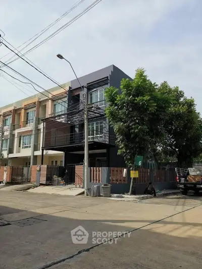 Modern townhouse with sleek design and spacious layout in a suburban neighborhood.