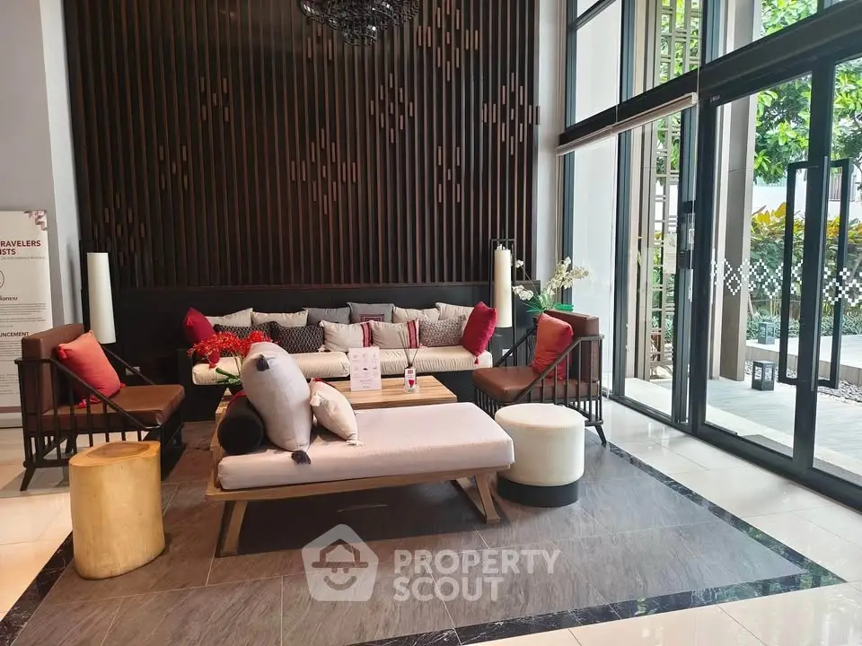 Luxurious modern living room with elegant decor and large windows offering garden views.