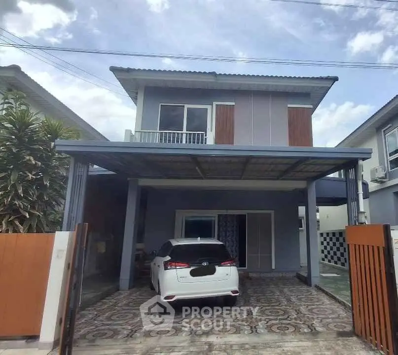 Modern two-story house with carport and stylish facade