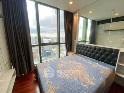 Luxurious bedroom with panoramic city view and elegant decor