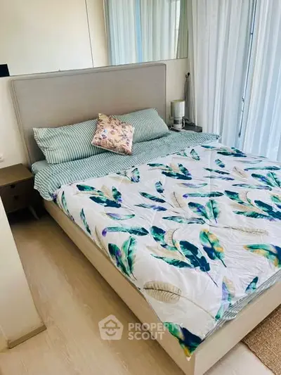 Cozy bedroom with stylish decor and natural light, featuring a comfortable bed and elegant bedding.