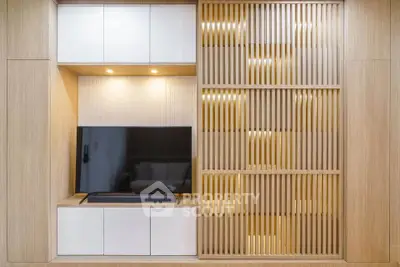 Modern living room with sleek TV unit and stylish wooden paneling