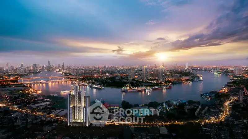 Stunning cityscape view with river and modern high-rise building at sunset.