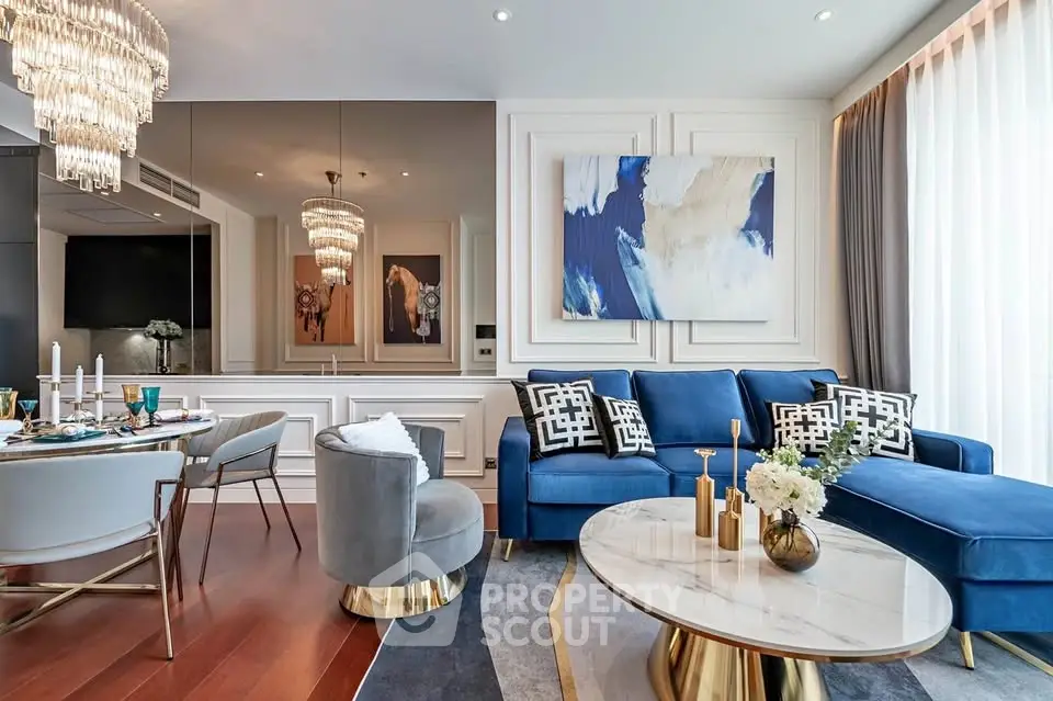 Luxurious modern living room with elegant decor and plush blue sofa