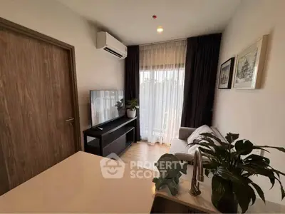 Cozy living room with modern decor, large window, and air conditioning unit.
