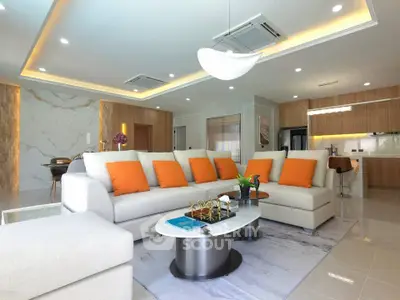 Luxurious modern living room with elegant decor and open kitchen layout, featuring plush seating and stylish lighting.