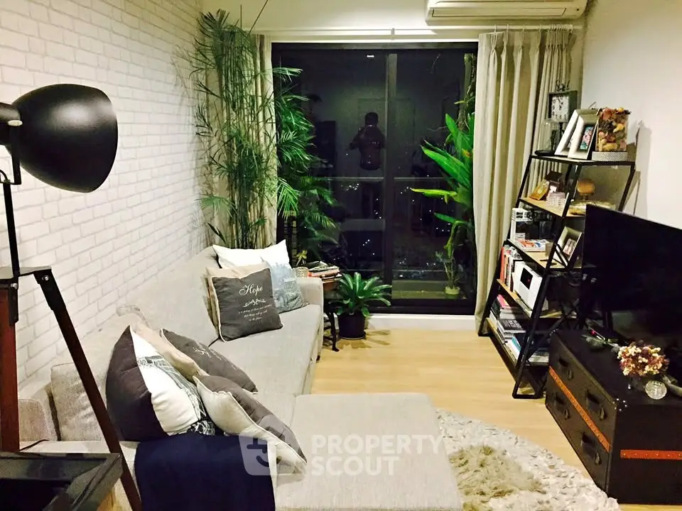 Cozy living room with modern decor and large window view