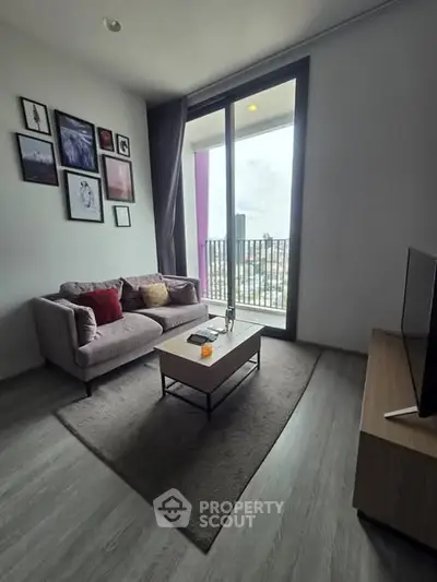 Modern living room with cozy sofa and large window balcony view