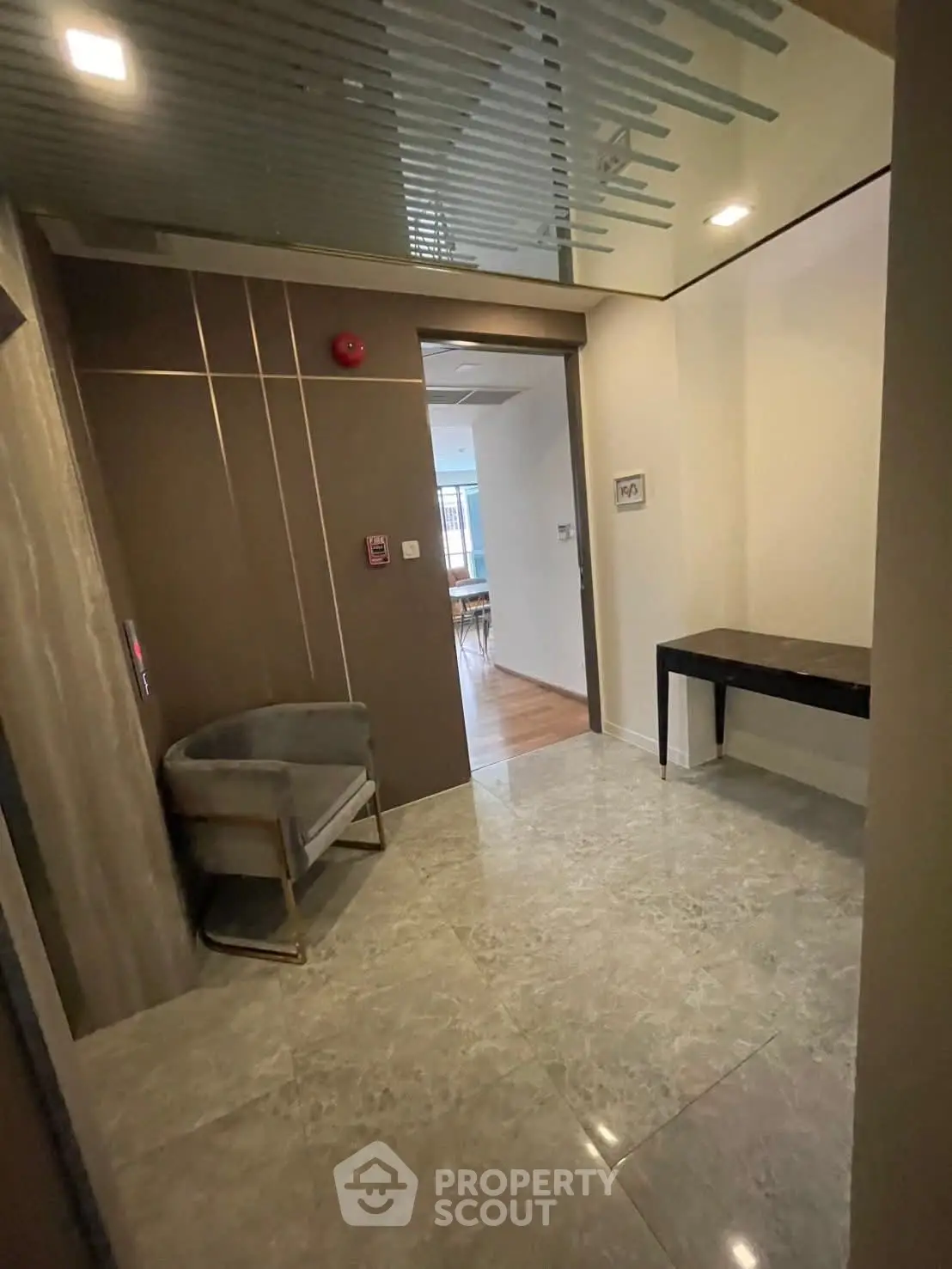 Modern apartment entrance with sleek design and elegant flooring