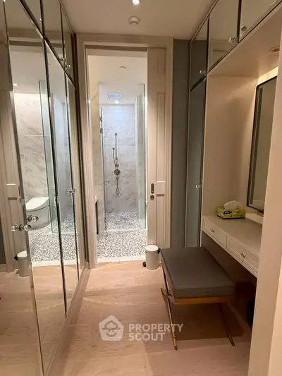 Luxurious bathroom with elegant mirrored cabinets and modern shower design