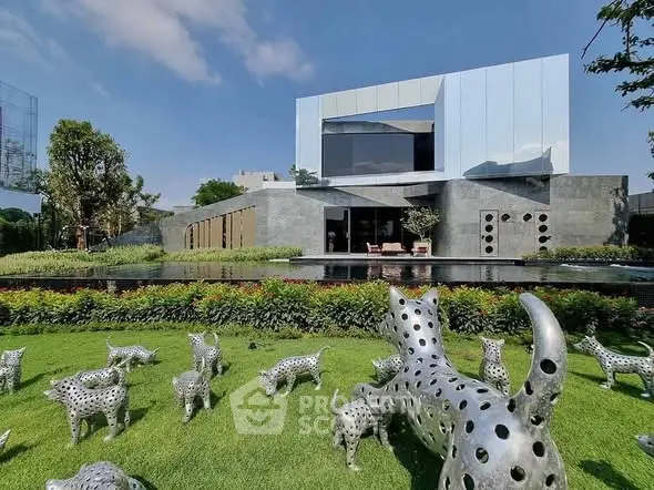 Modern architectural masterpiece with unique sculpture garden and sleek facade.