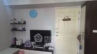Cozy living room with wall-mounted TV and modern decor