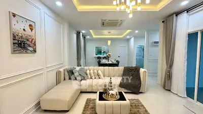 Luxurious modern living room with elegant decor and cozy seating area.