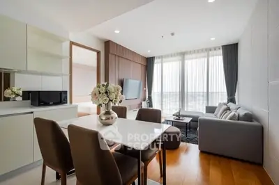 Modern living room with elegant dining area and panoramic city view