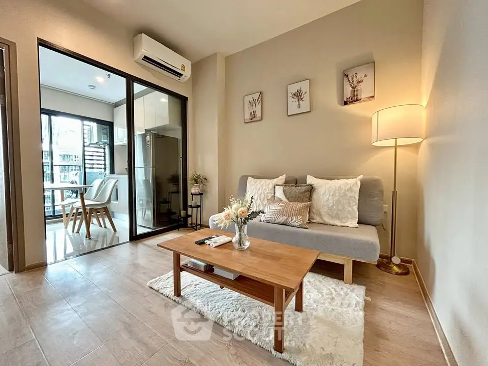 Stylish living room with cozy sofa and modern decor in open-plan apartment