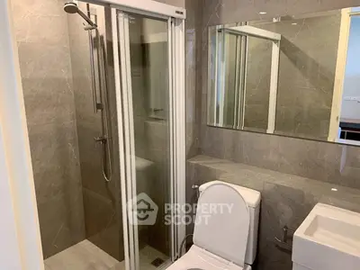 Modern bathroom with sleek shower and elegant fixtures