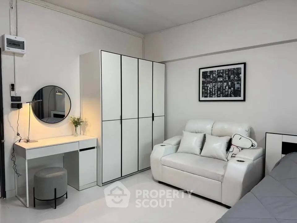 Modern living room with white furniture and stylish decor