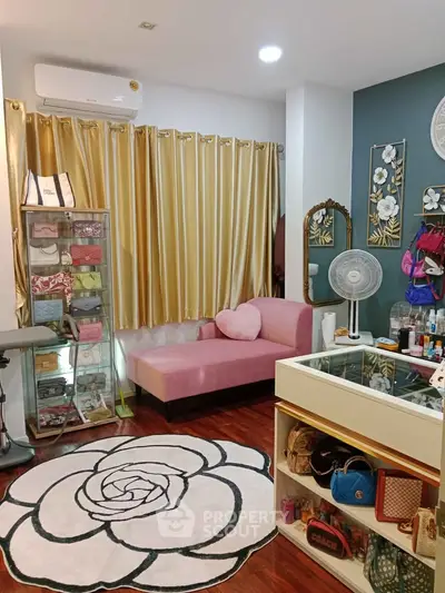Chic and stylish living room with pink sofa and floral decor, perfect for modern urban living.