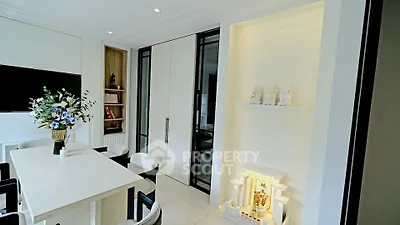 Elegant dining area with modern decor and built-in shelving, perfect for stylish entertaining.