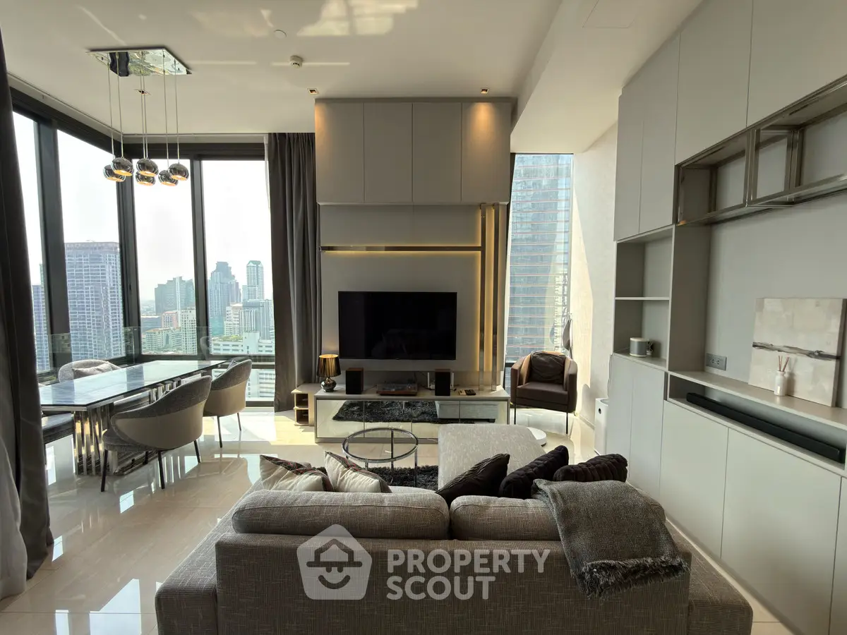 Luxurious living room with panoramic city views and modern furnishings