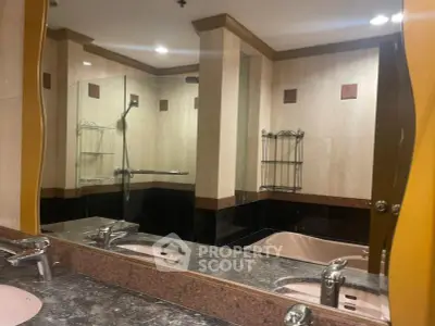 Luxurious bathroom with elegant marble countertops and spacious bathtub