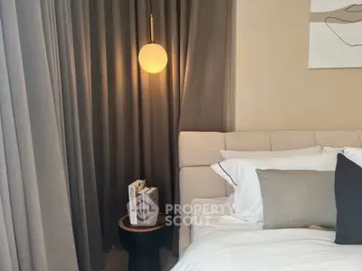 Cozy bedroom with modern lighting and elegant decor