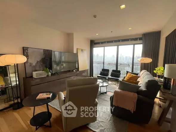 Spacious living room with city view and modern furnishings