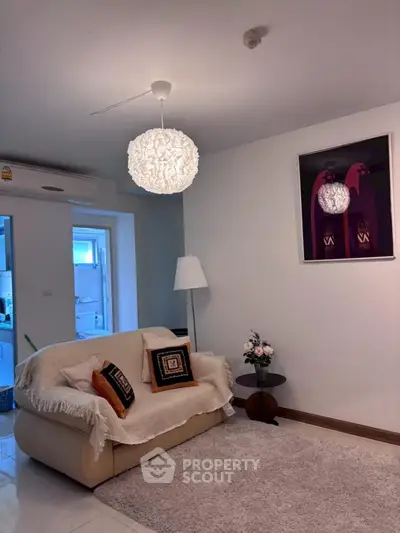 Cozy living room with modern decor and plush seating, perfect for relaxation.