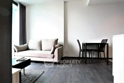 Modern living room with sleek furniture and natural light