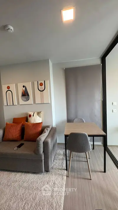 Modern living room with stylish decor and cozy seating area, perfect for relaxation and entertaining.