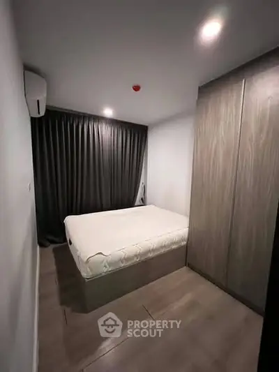 Cozy bedroom with modern design and ample storage space