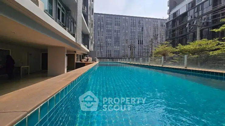 Luxurious modern pool with sleek architectural design and shimmering water.