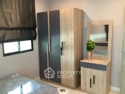 Modern bedroom with stylish wardrobe and vanity set