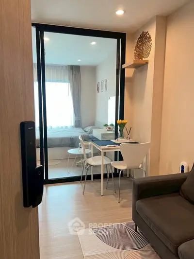 Modern apartment interior with cozy living area and dining space