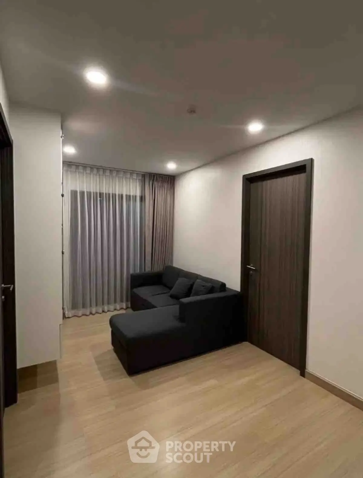 Modern living room with sleek design and cozy sofa