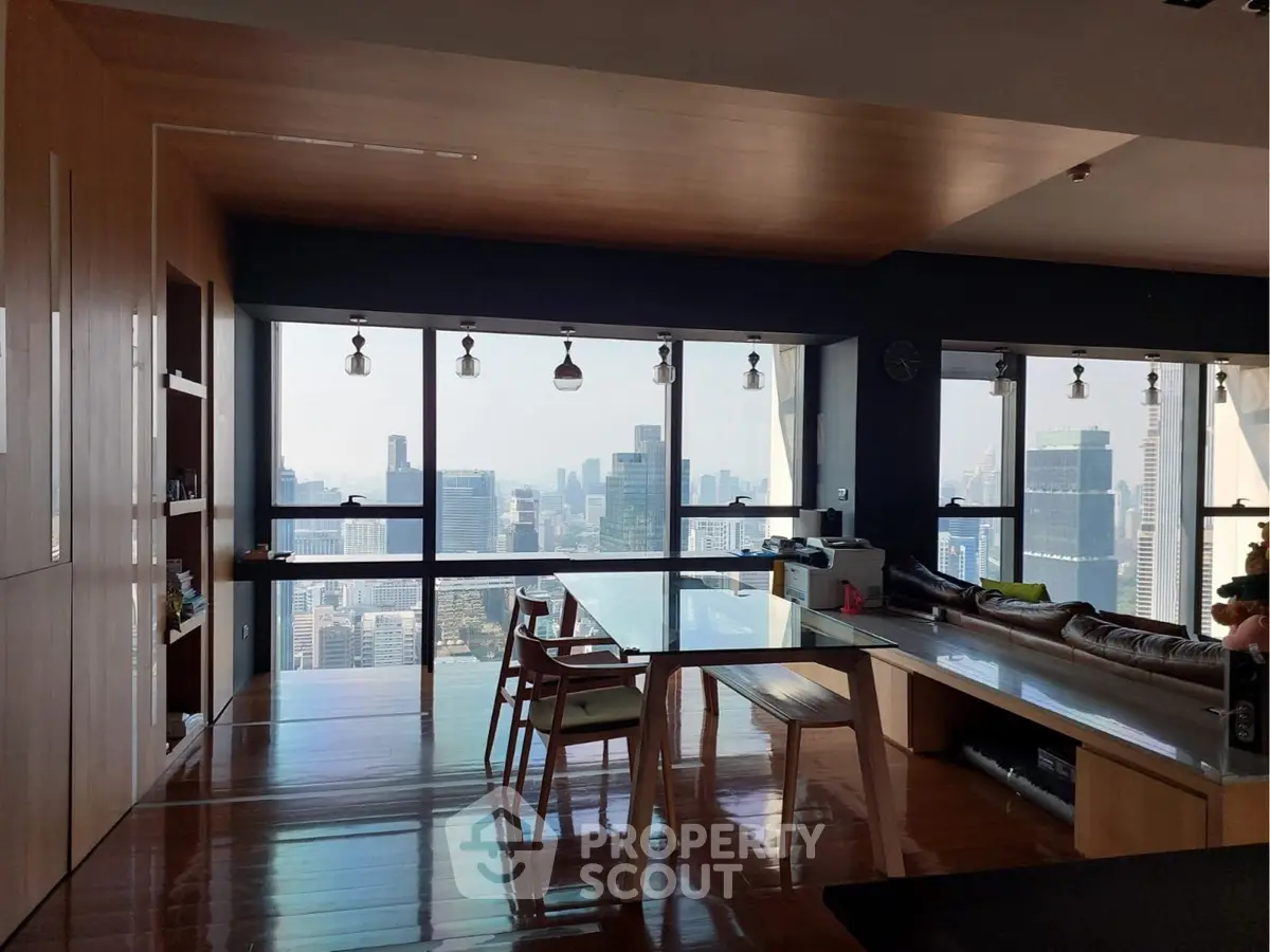 Luxurious high-rise apartment with stunning city skyline view and modern interior design.