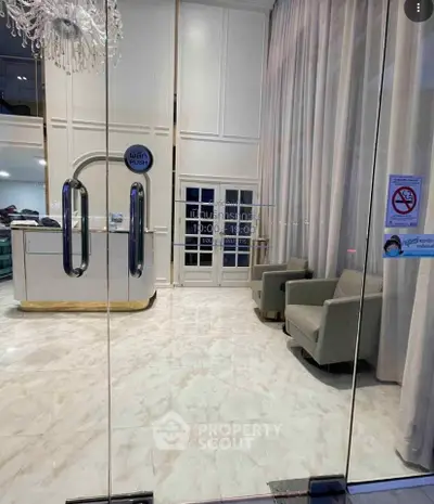 Elegant lobby entrance with modern decor and seating area