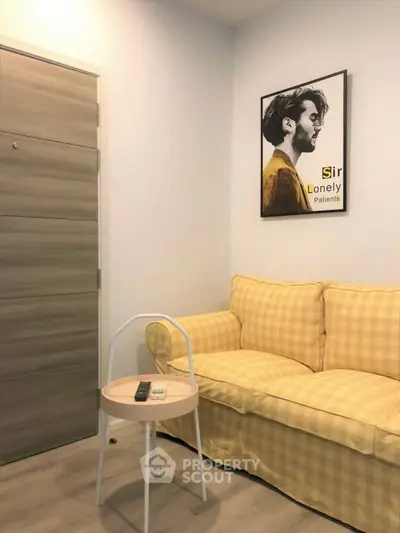 Cozy living room with yellow checkered sofa and stylish wall art, perfect for relaxation.