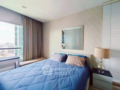 Modern bedroom with city view, stylish decor, and cozy ambiance.