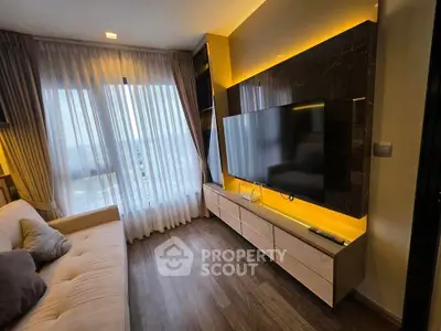 Modern living room with large TV and stylish lighting