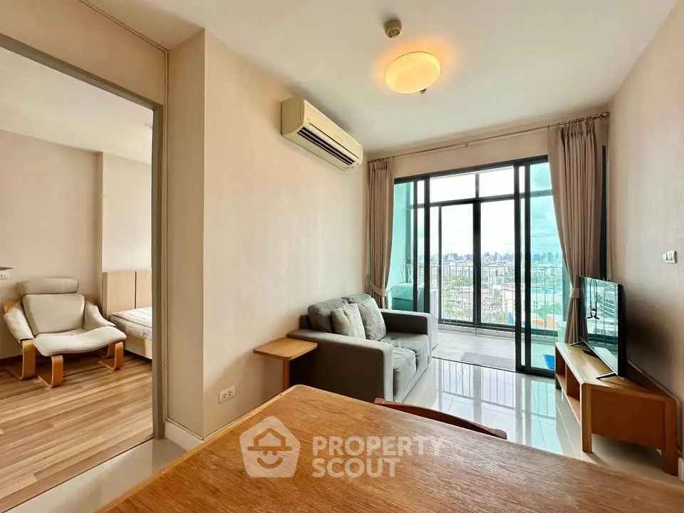 Modern living room with balcony and city view in high-rise apartment