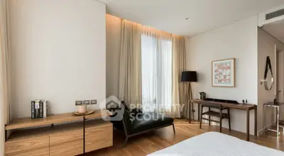 Elegant bedroom with modern decor and natural light