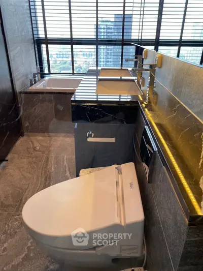 Luxurious modern bathroom with city view, featuring sleek fixtures and elegant marble finishes.