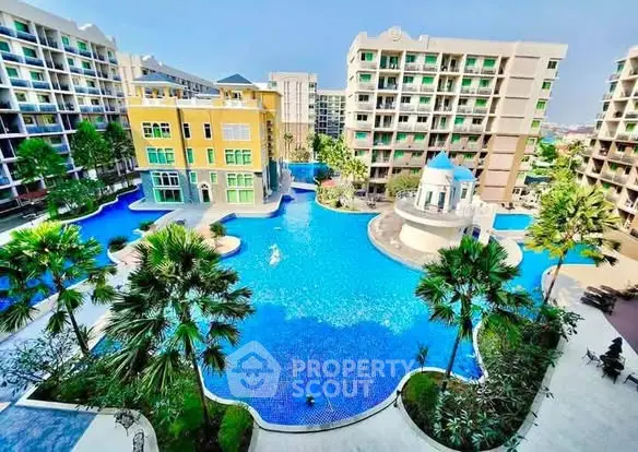 Luxurious residential complex with stunning pool and lush landscaping