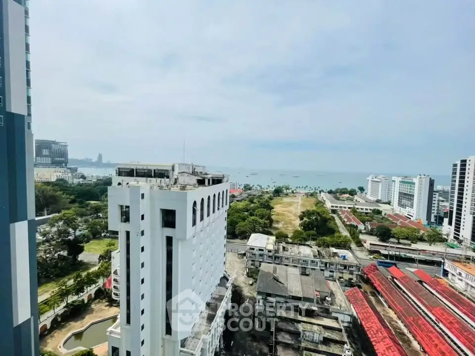 Stunning high-rise view of cityscape and ocean, perfect for urban living with breathtaking scenery.